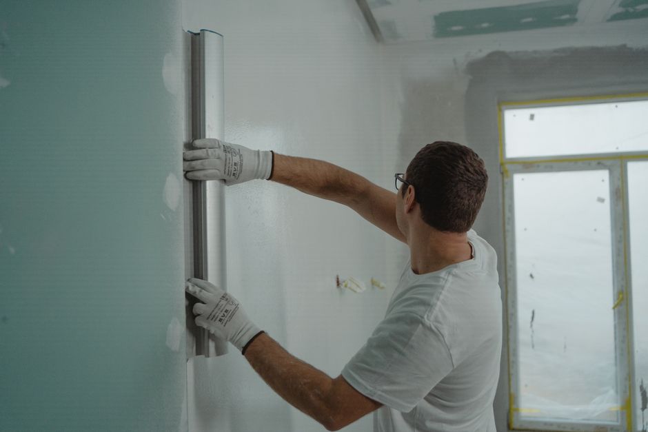 Home renovation contractor reviewing blueprints